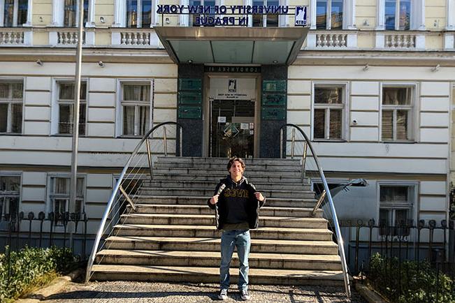 Anthony in front of the University of New York in Prague building